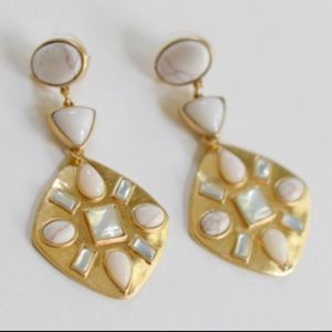 Gold earrings with white stone-looking details